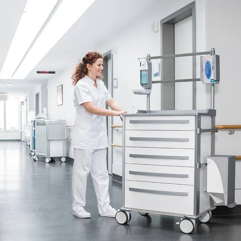 Nurse pushing a ZARGES medical cart along a hospital ward