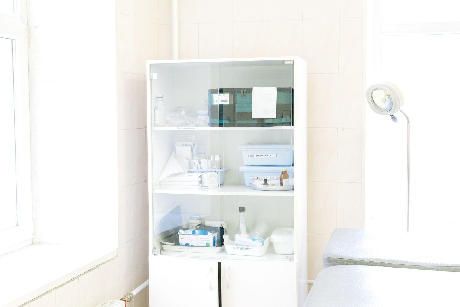 White cabinet stocked with medical supplies